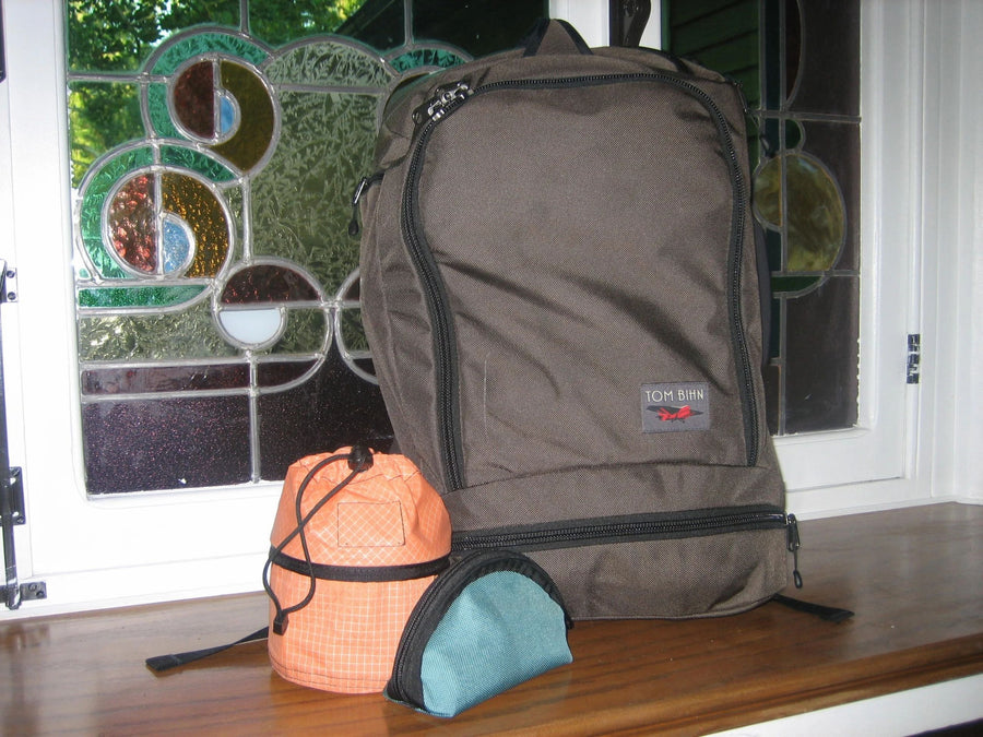 A Techonaut 30, Small Travel Tray, and Q-Kit sitting together on a windowsill