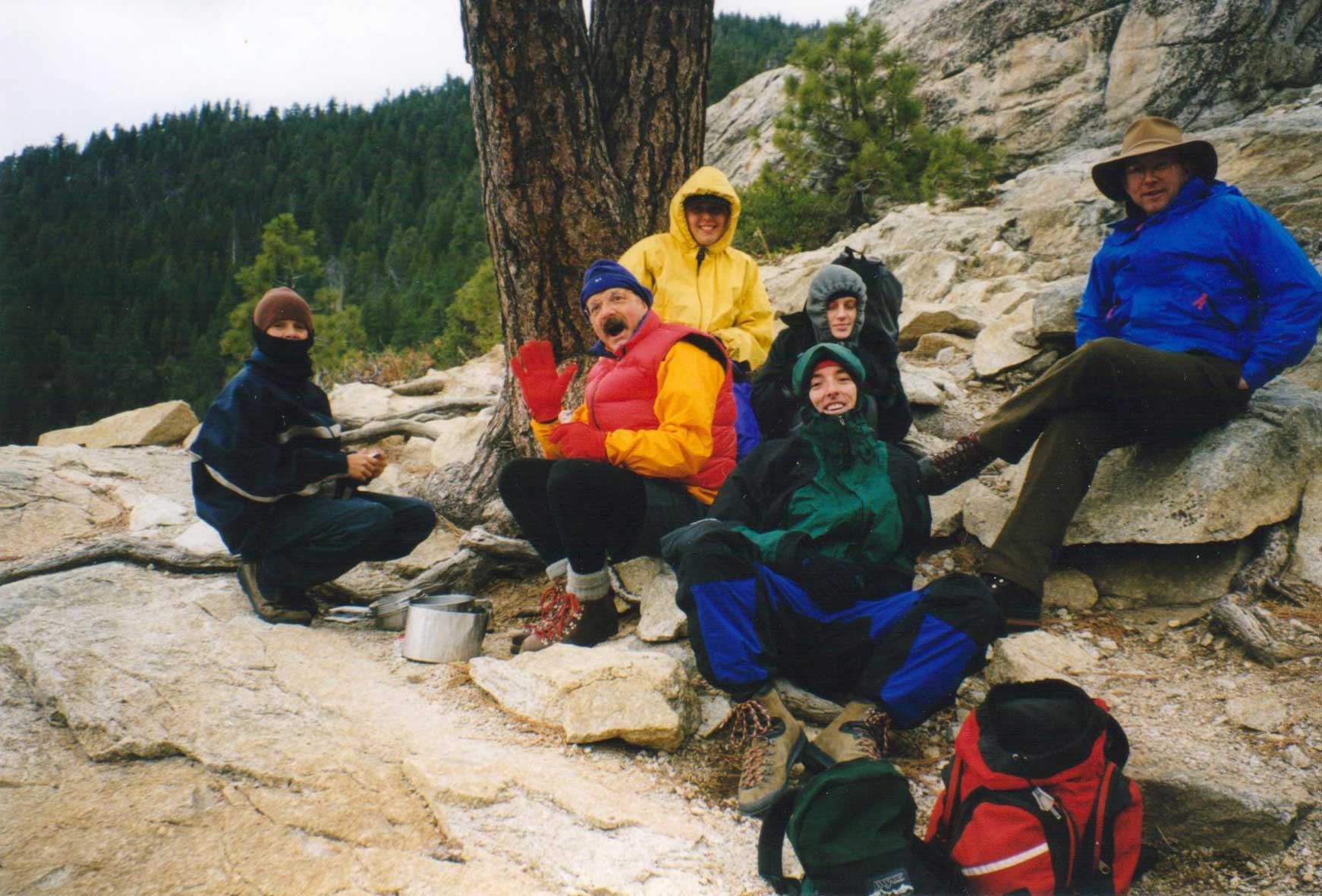 Tom and his friends on a chilly hike in Yosemite: everyone's wearing brightly colored outdoor gear.
