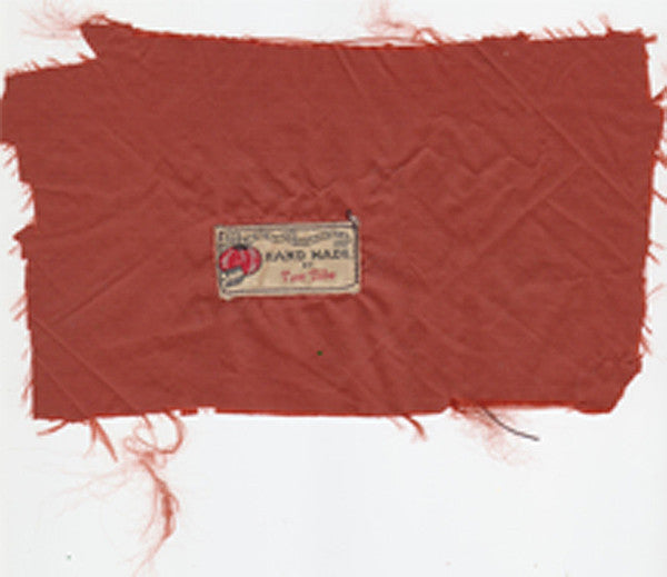 The very first "TOM BIHN" label, sewn in a couple of dozen down jackets in the early 1970s.