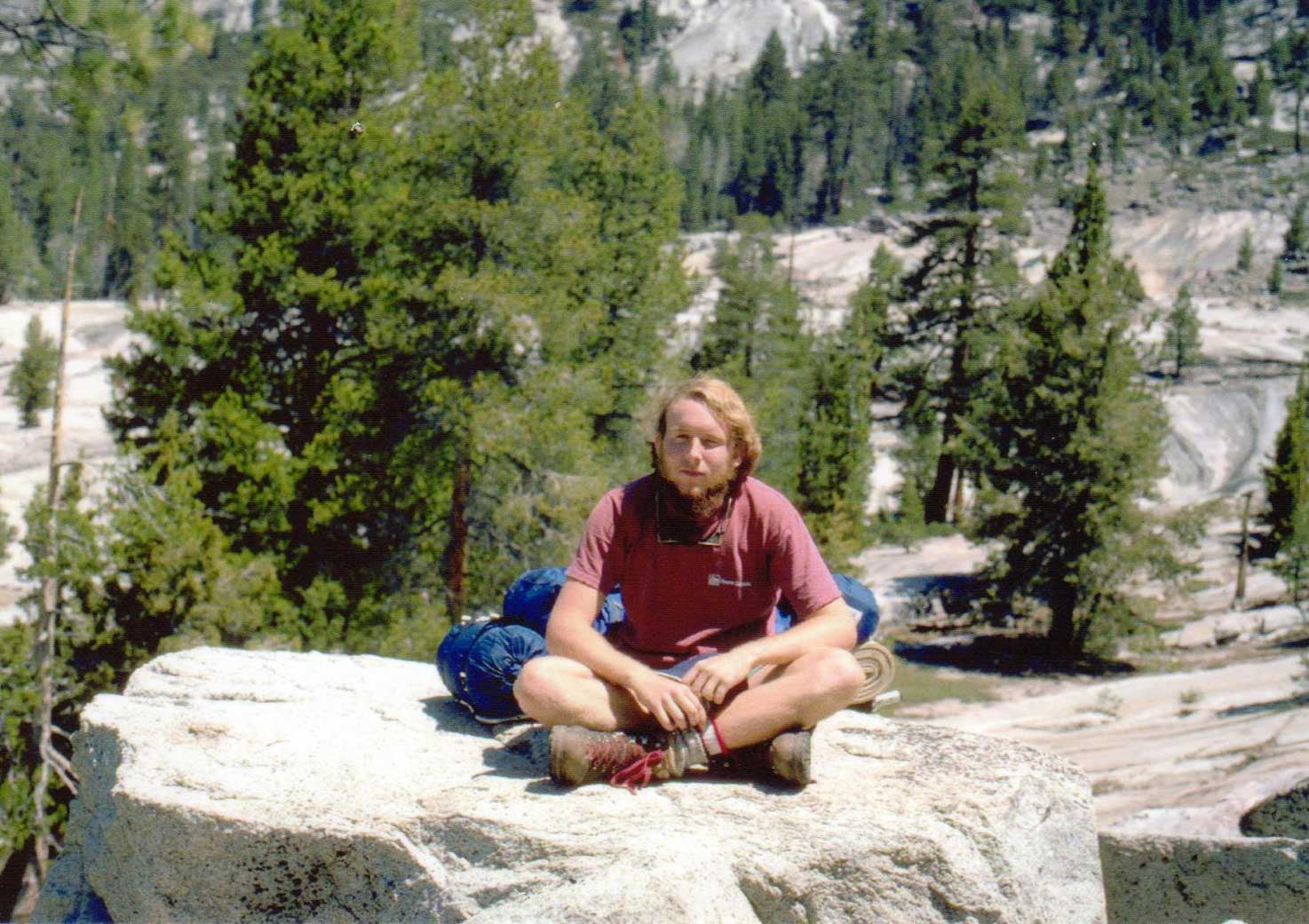 Tom on a solo backpacking trip in the back country of Yosemite, 1977. The pack hiding behind him was built by Tom for a classic Kelty external frame called the Massif.