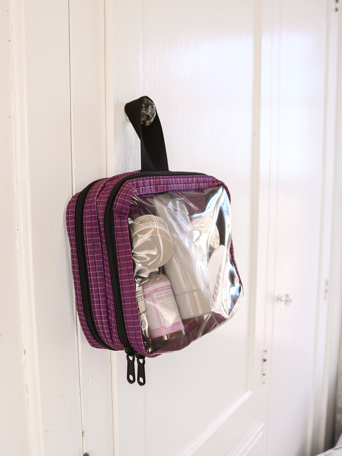 visible lifestyle^^Double Clear Organizer Cube with toiletries in it hanging on a cabinet