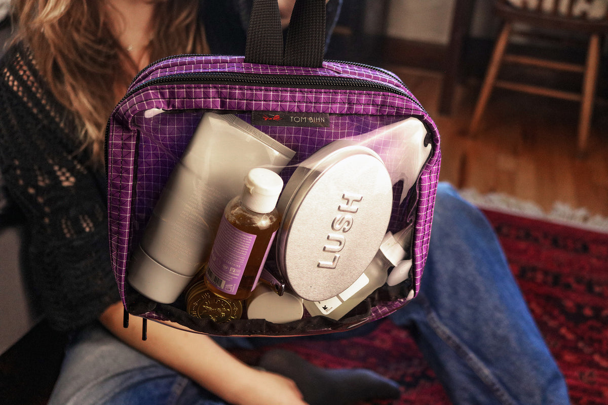 visible lifestyle^^A person holding a Double Clear Organizer Cube with make-up supplies in it