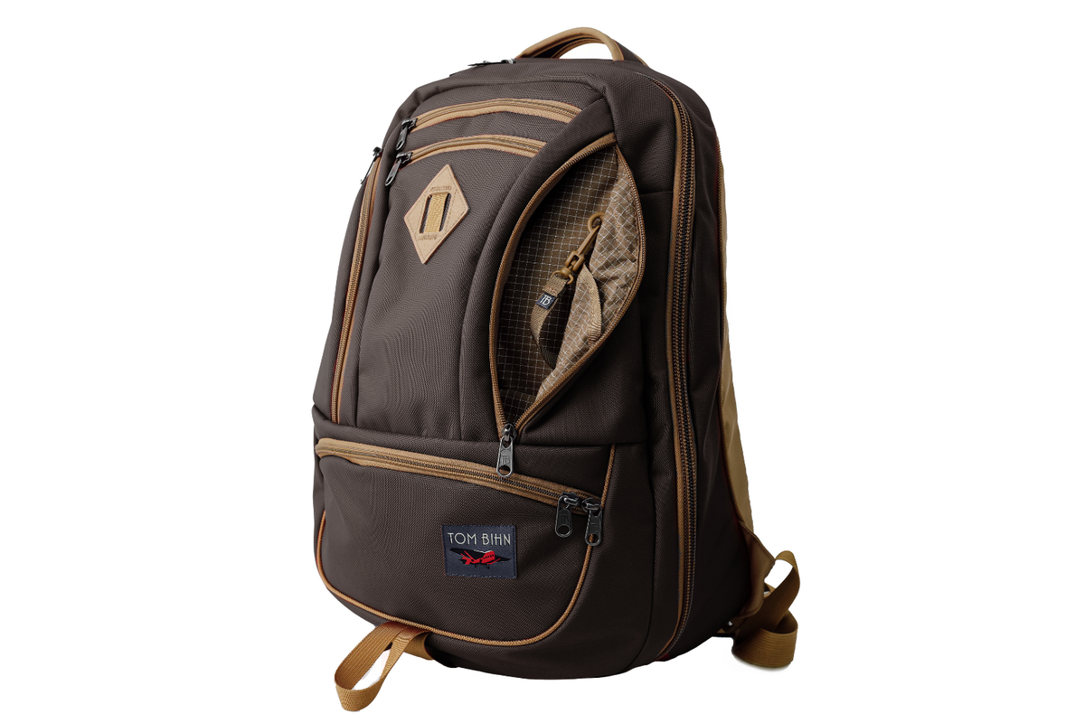 visible variant TB0183-RKCD^^The Guide's Edition Synik 30 in Brown 630 Ballistic. Brown backpack with gold accents on a white background