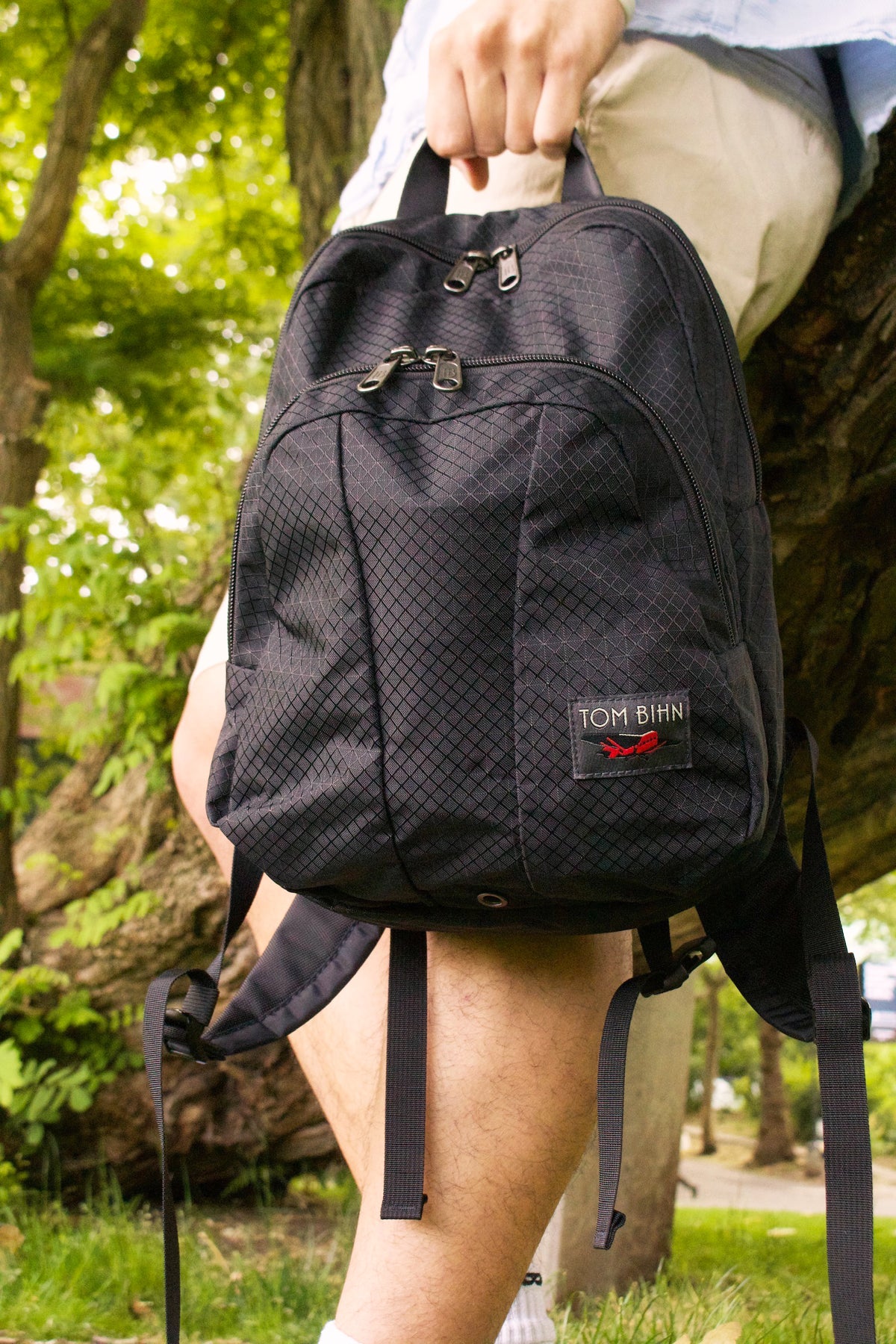 visible lifestyle^^ Person holding the Paradigm by the grab handle.
