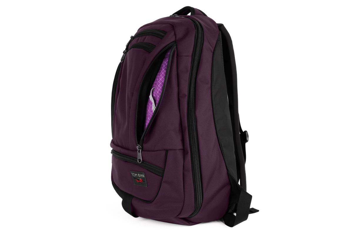 variant visible TB0122-UKUD^^ Purple backpack with black straps on a white background. 