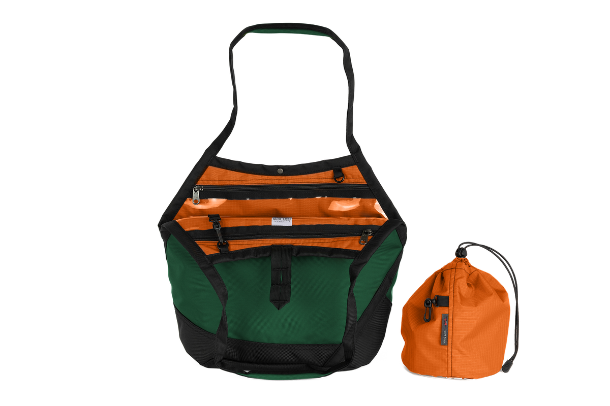 visible variant TB0660-WKPL^^A Swift in Wilderness Ballistic with Persimmon (dark orange with orange grid) 210 Cerylon interior and Yarn Stuff Sack.