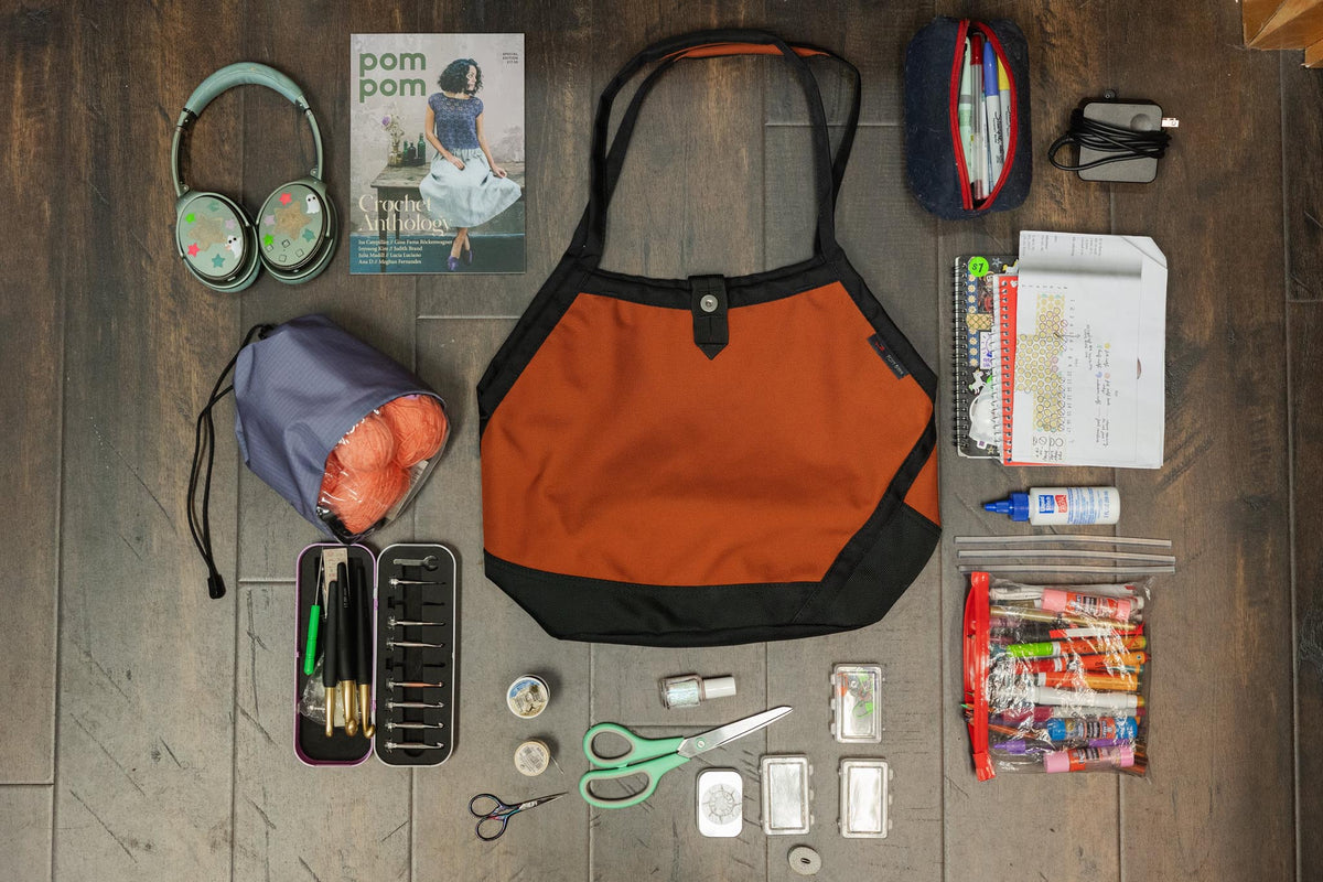 visible lifestyle^^A Swift with crafting items laid out around it.