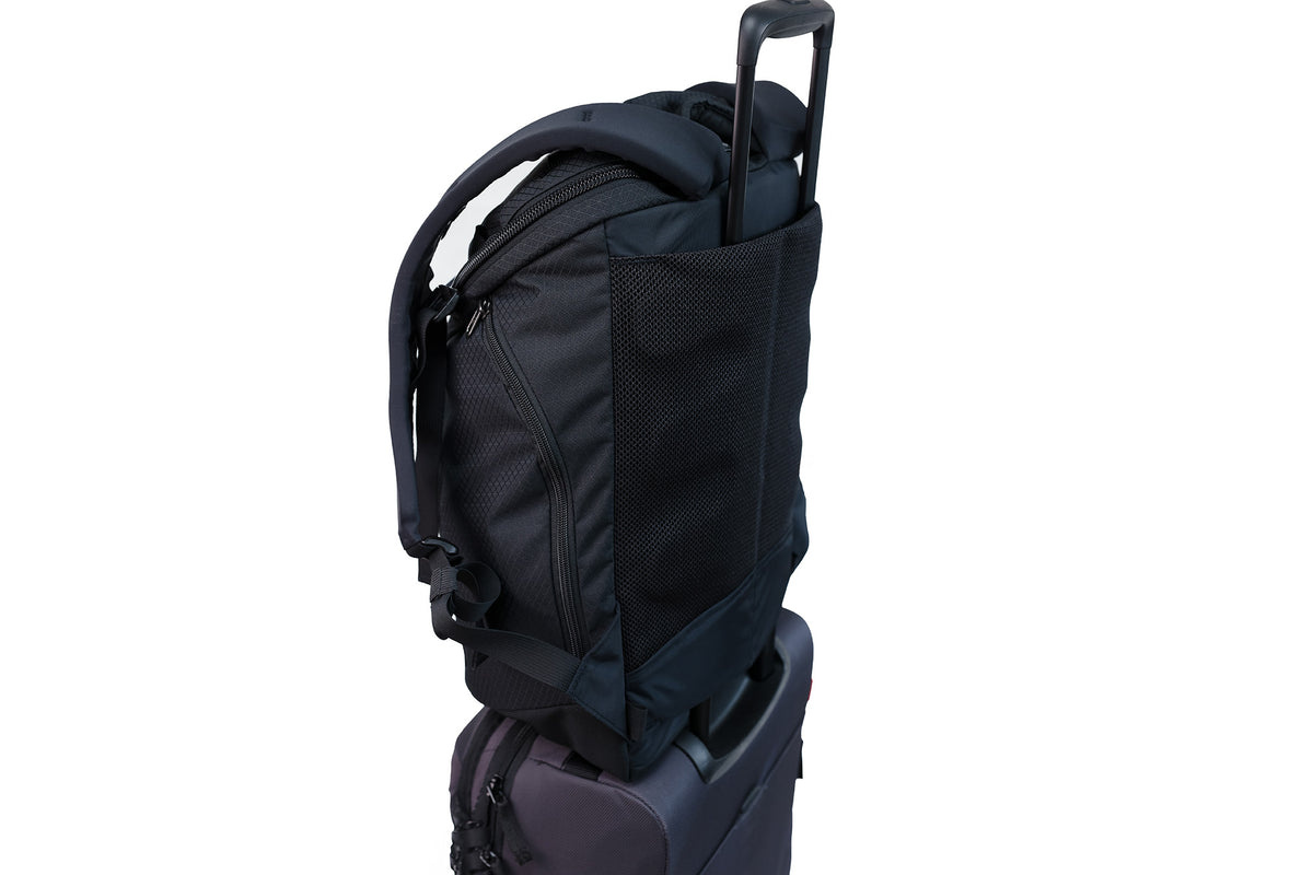 The Smart Alec 2.0 over the handle of a rollaboard bag.