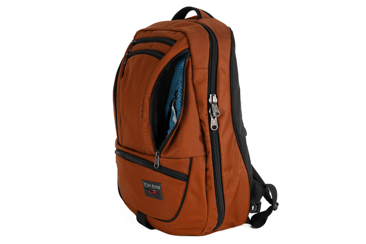 visible variant TB0121-TKFD^^The Synik 30 in Burnt Orange Ballistic with a Fjord (dark blue with white grid) 200 Halcyon interior.