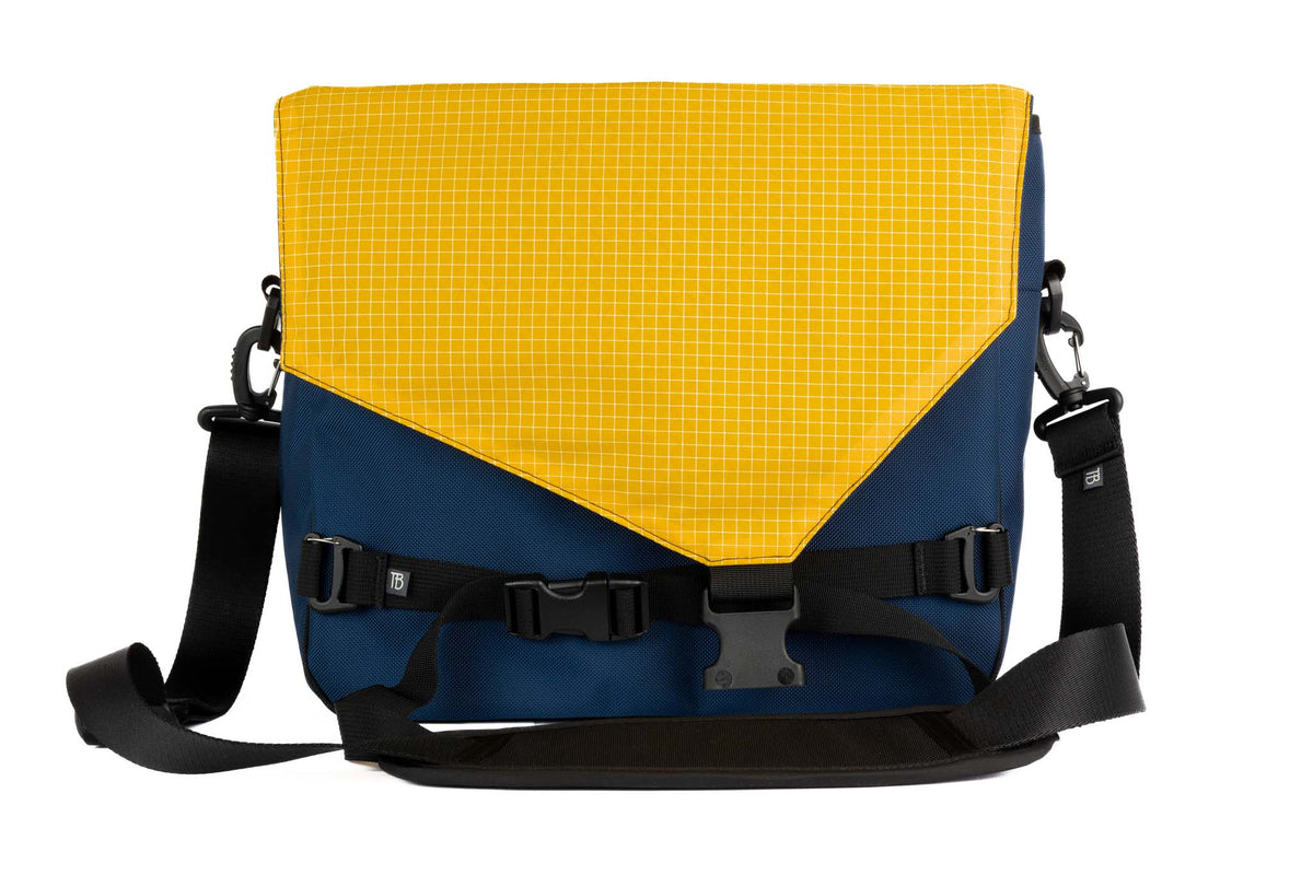 visible variant TB0204-DKOD^^The Maker's Bag in Deep Blue (dark blue) 525 Ballistic with a Solaris (yellow with white grid) Halcyon interior.