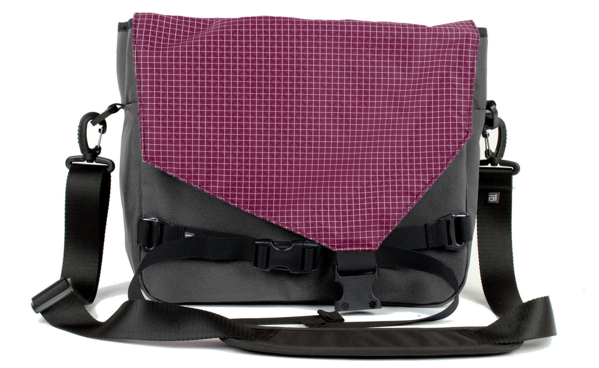 visible variant TB0204-GK5D^^The Maker's Bag in Nebulous Grey (Medium grey) Ballistic with a Acai (dark purple with white grid) 200 Halcyon interior.