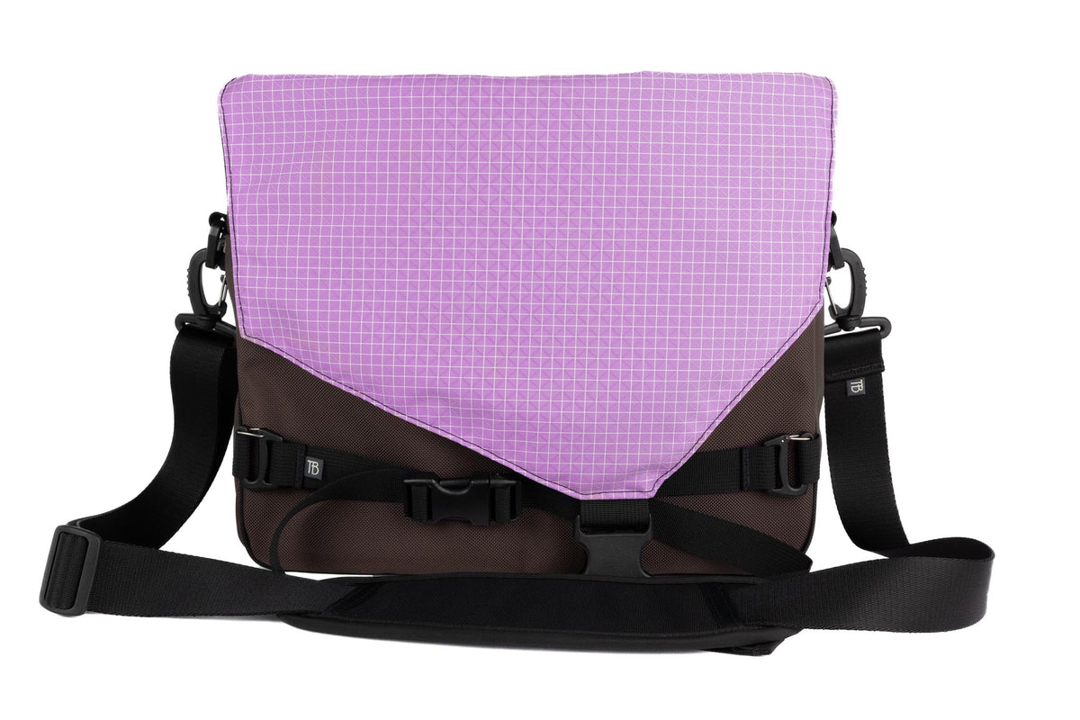visible variant TB0204-RKYD^^The Maker's Bag in Ursa (brown-grey) Ballistic with a Wisteria (pale purple with white grid) 200 Halcyon interior.