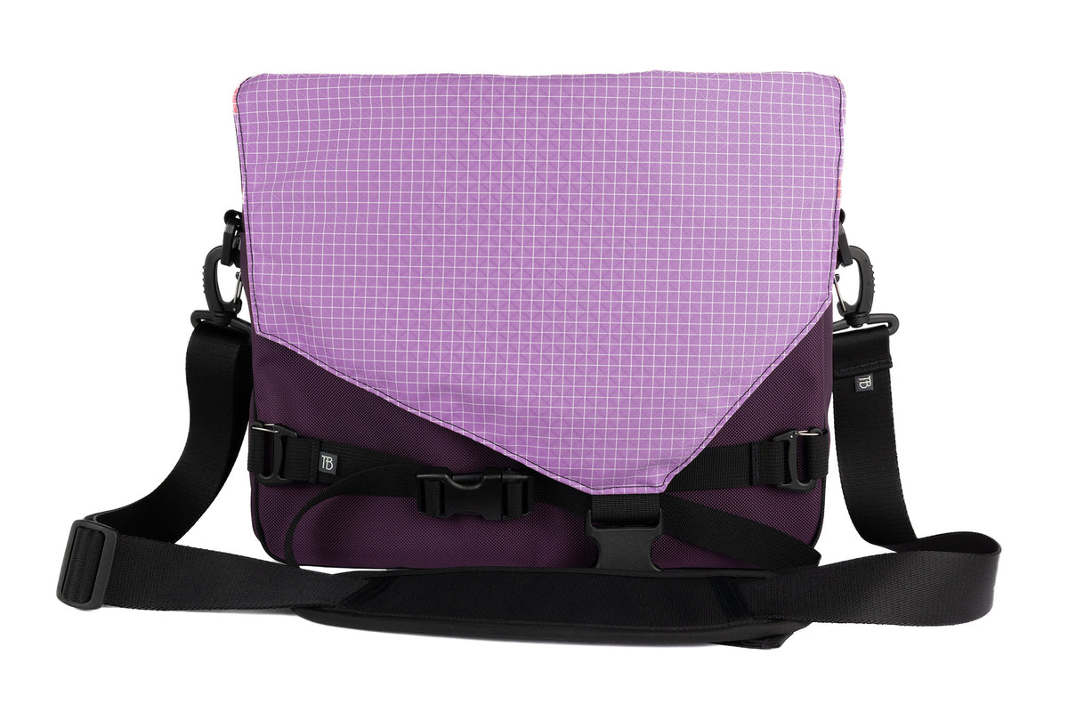 visible variant TB0204-UKYD^^The Maker's Bag in Aubergine (dark purple) Ballistic with a Wisteria (light purple with white grid) 200 Halcyon interior.