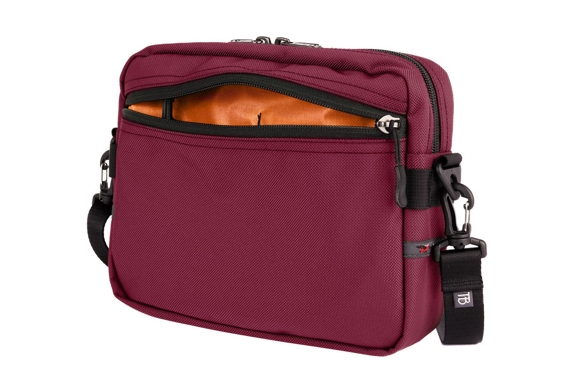 visible variant TB0414-PKPL^^The Side Kick in Raspberry (reddish purple) 630 Ballistic with an Persimmon (purple with light purple grid) 200 Halcyon interior.
