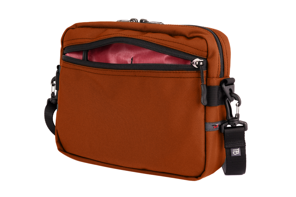 visible variant TB0414-TKSL^^The Side Kick in Burnt Orange Ballistic with an Sangria (red with dark red grid) 200 Halcyon interior.