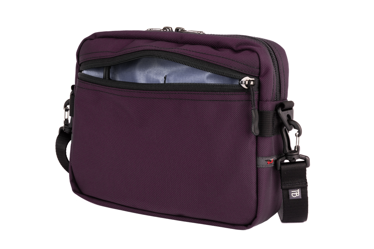 visible variant TB0414-UKDL^^The Side Kick in Aubergine (dark purple) Ballistic with a Dusk (purplish-blue with light purplish-blue grid) 200 Halcyon interior.