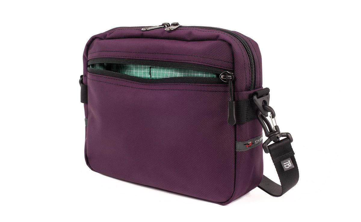 visible variant TB0414-UKGD^^The Side Kick in Aubergine (dark purple) Ballistic with an Seafoam (pale green with white grid) 200 Halcyon interior.