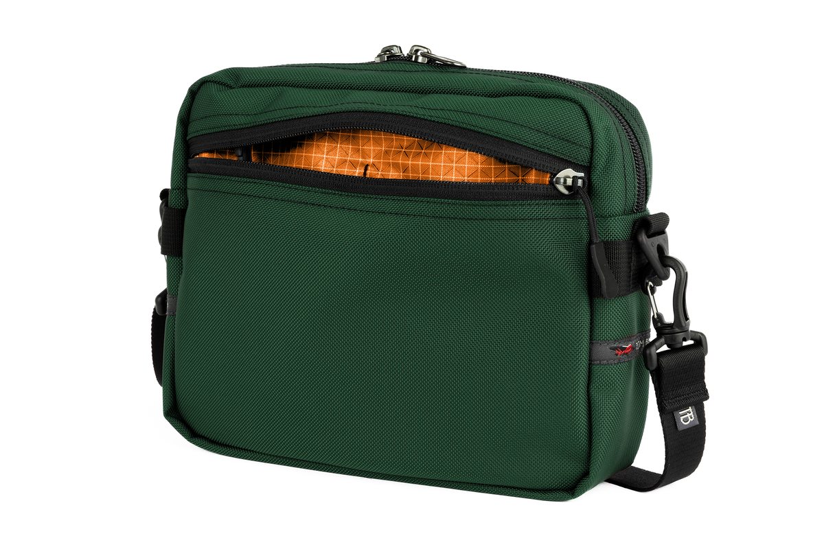 visible variant TB0414-WKZD^^The Side Kick in Wilderness (forest green) Ballistic with Zest (orange with white grid) 200 Halcyon interior.