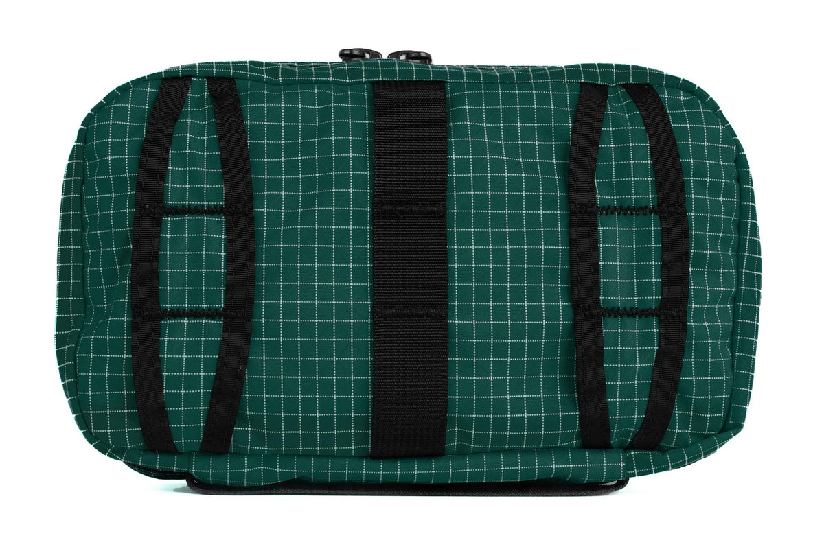 visible variant TB0419-KD^^The rear of a Handy Little Thing #2 in Sitka (dark green with white grid) 200 Halcyon showing the front zipper with two slider and logo at the bottom-right corner.