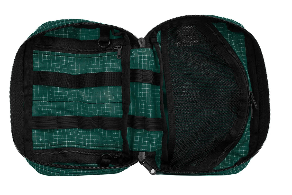 visible variant TB0419-KD^^The inside of a Handy Little Thing #2 in Kiwi (dark green with white grid) 200 Halcyon showing the front zipper with two slider and logo at the bottom-right corner.