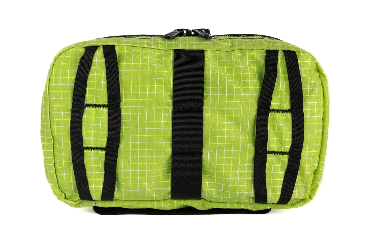visible variant TB0419-1D^^The rear of a Handy Little Thing #2 in Kiwi (bright green with white grid) 200 Halcyon showing the front zipper with two slider and logo at the bottom-right corner.