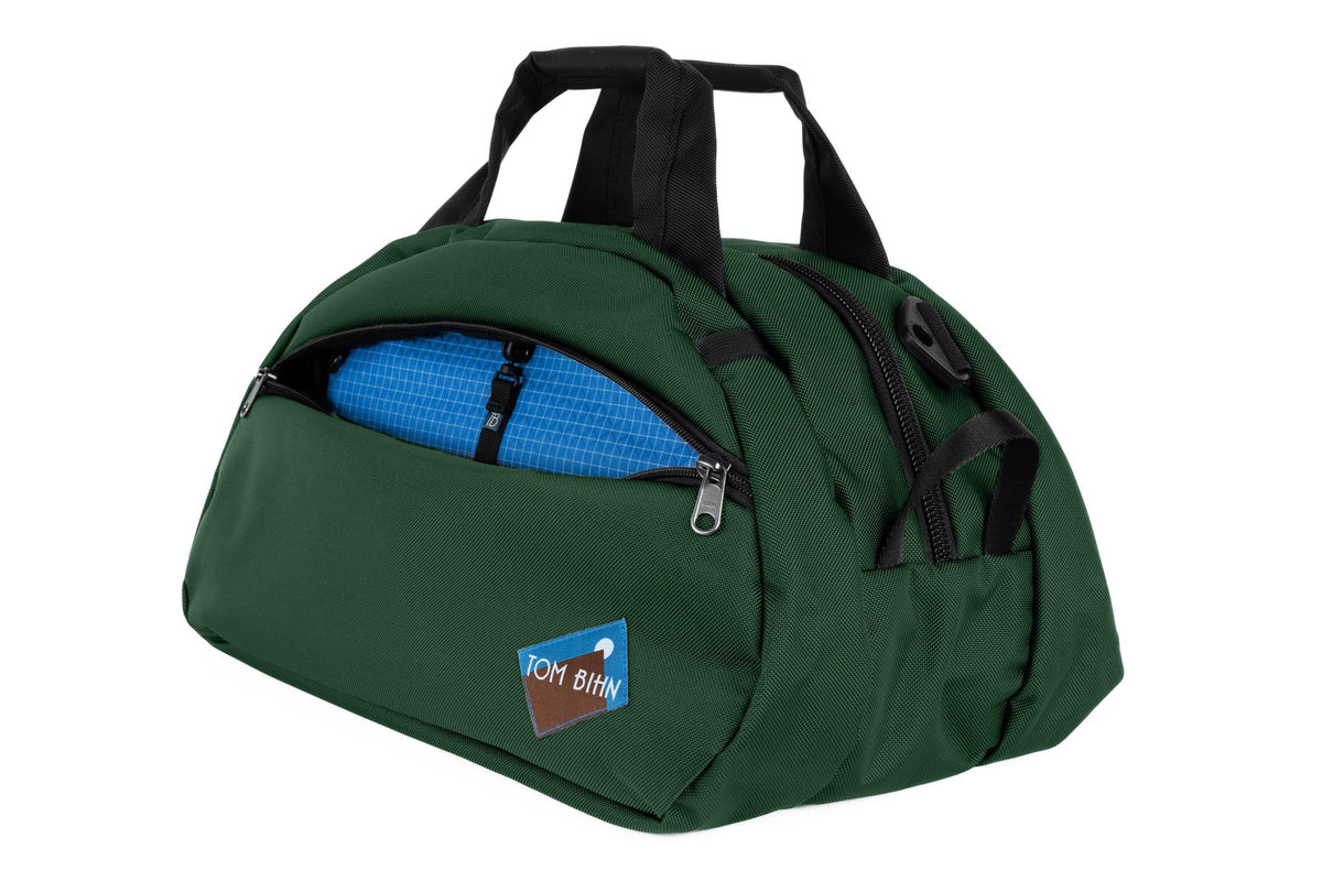 visible variant TB0435-WKLD^^The Old School Carry All in Wilderness 630 Ballistic with Island (blue with white grid) 200 Halcyon interior.