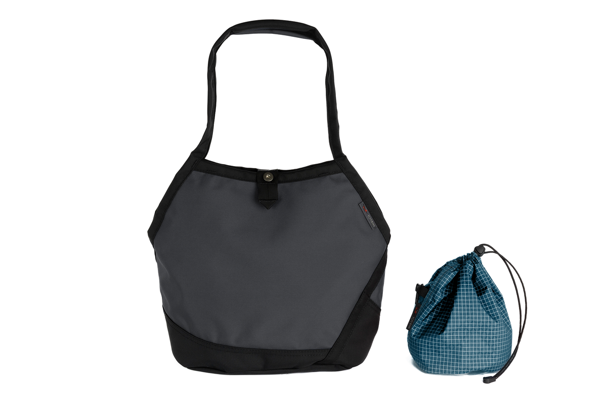 visible variant TB0660-GKFD^^A Swift in Nebulous Ballistic with Fjord (dark blue with white grid) 200 Halcyon interior and Yarn Stuff Sack.