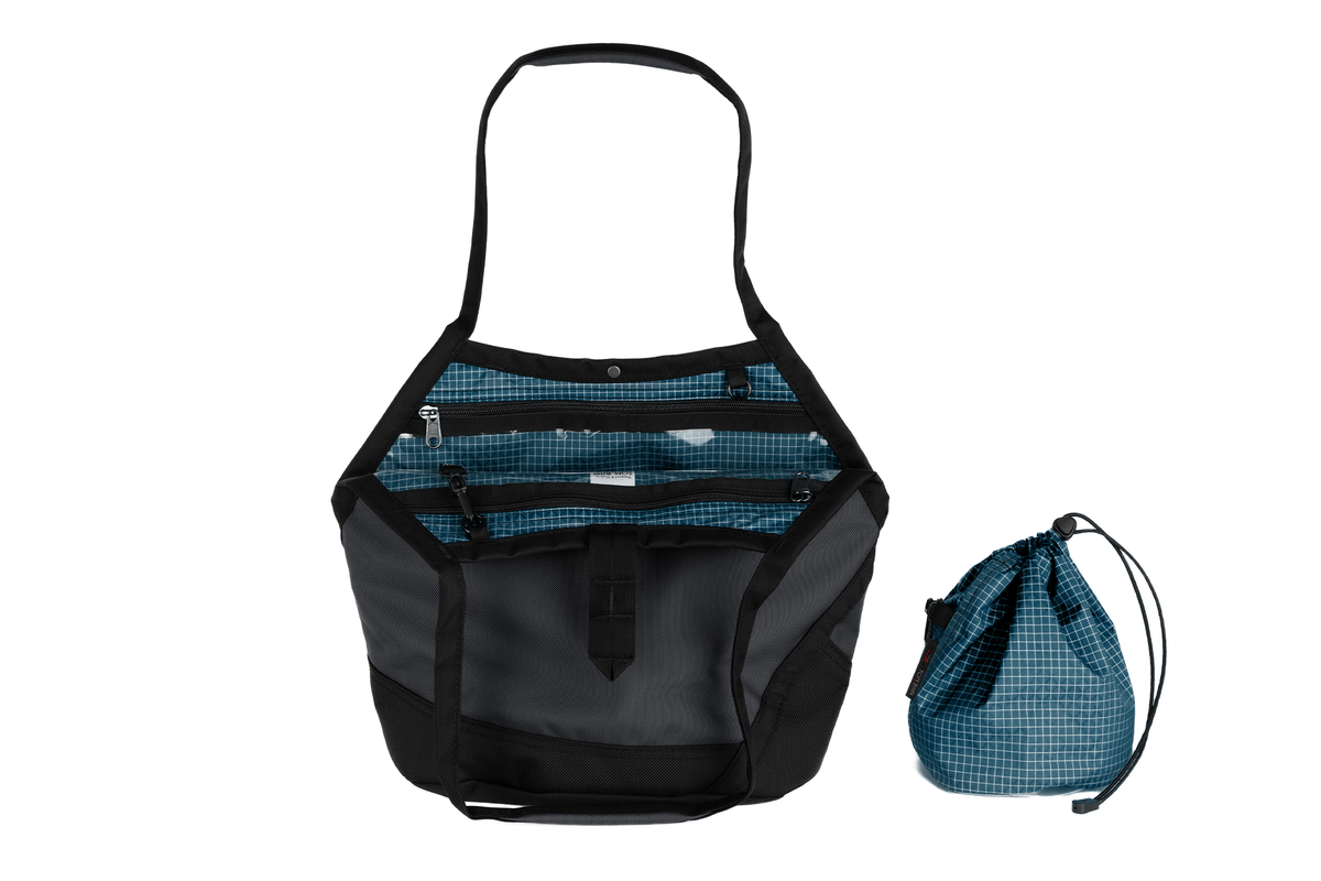 visible variant TB0660-GKFD^^A Swift in Nebulous Ballistic with Fjord (dark blue with white grid) 200 Halcyon interior and Yarn Stuff Sack.