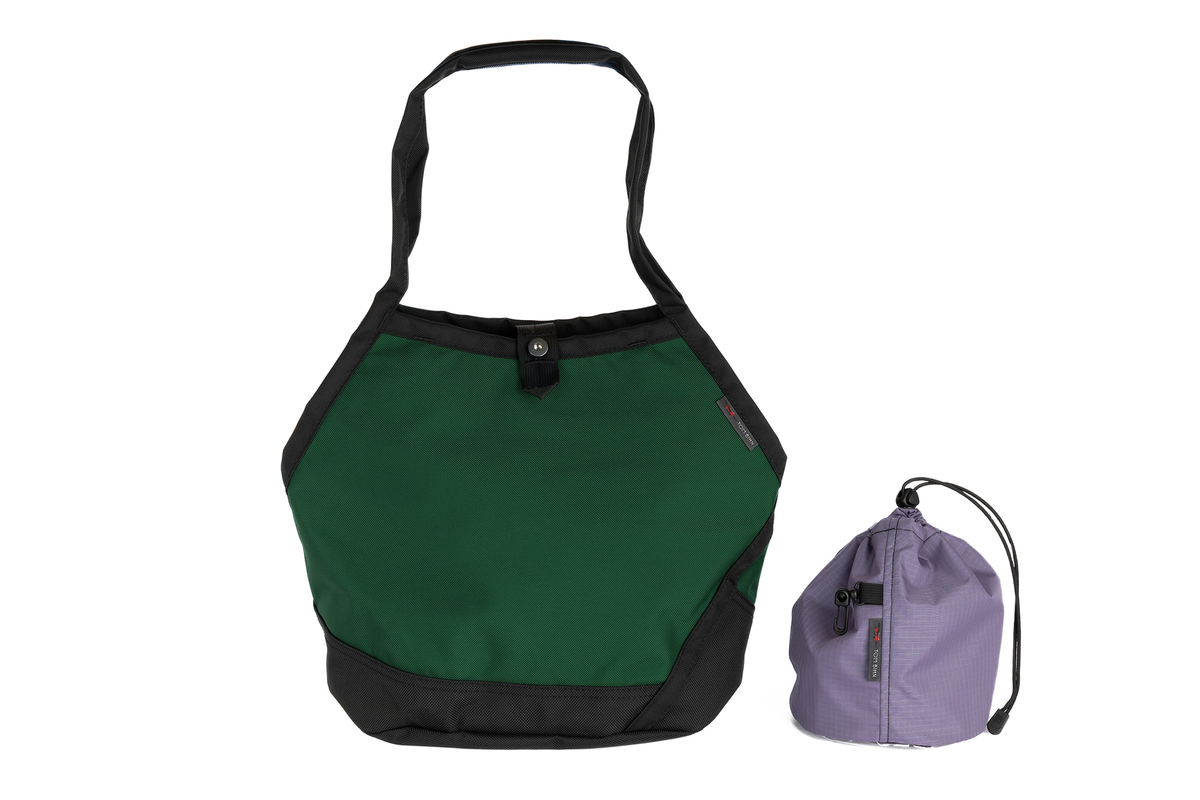 visible variant TB0660-WKDL^^A Swift in Wilderness Ballistic with Dusk (purplish-blue with light purplish-blue grid) 210 Cerylon interior and Yarn Stuff Sack.