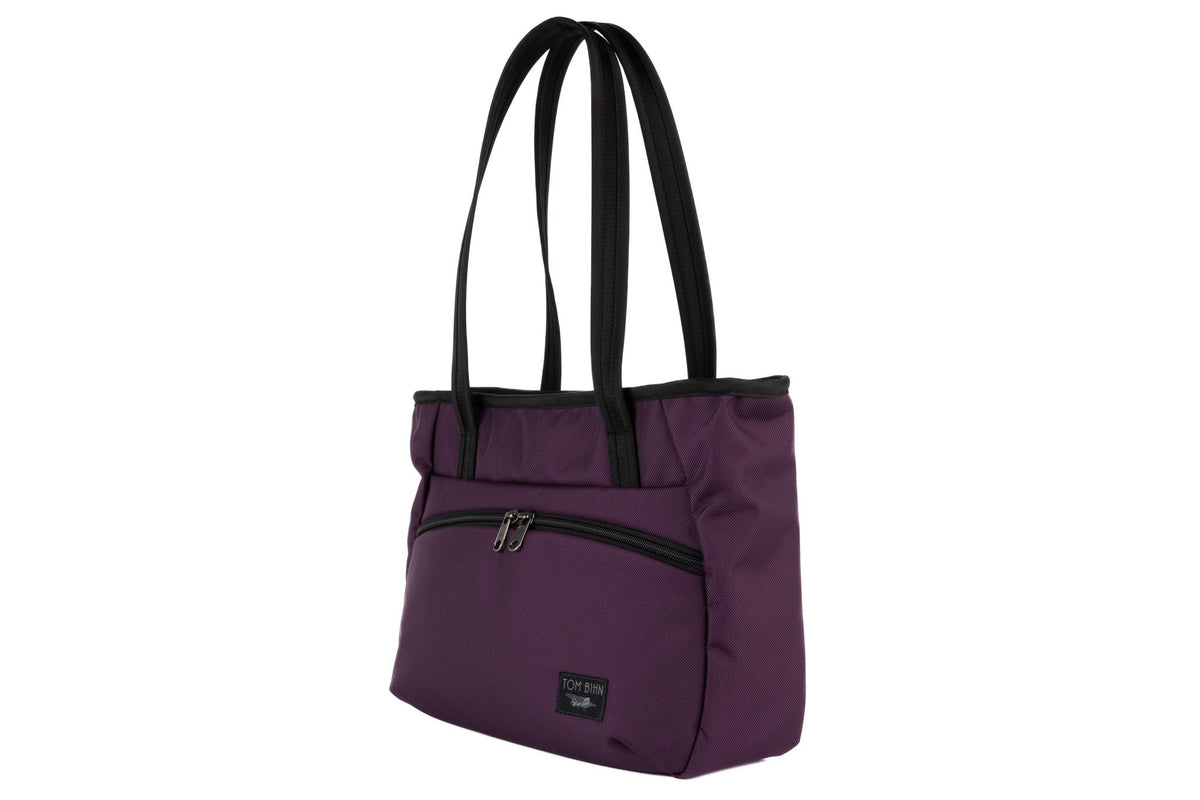 visible variant TB0715-UKYD TB0715-UKDL^^Photo of the Nomad Tote in Aubergine Ballistic.