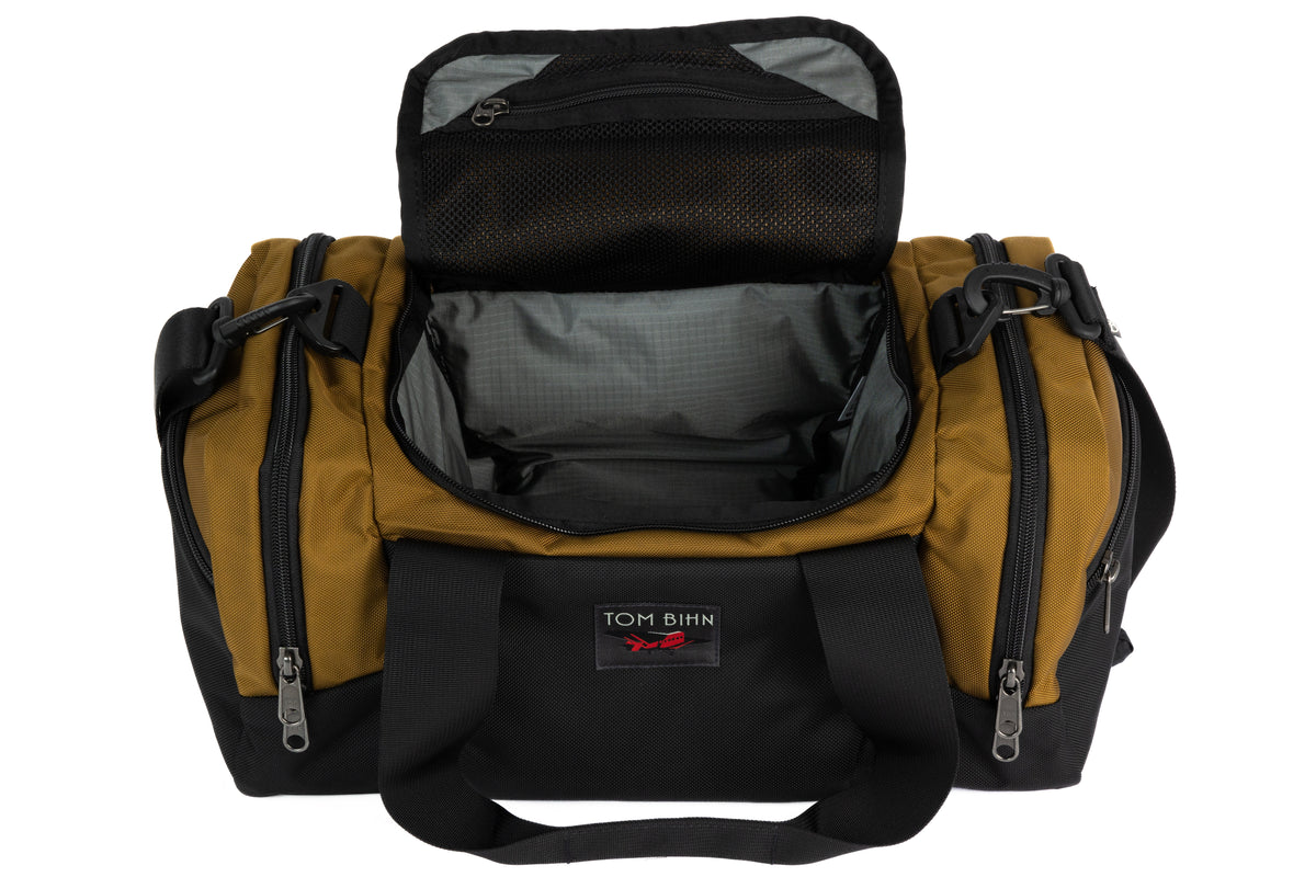 visible variant TB0904-CKGL^^The Night Flight Travel Duffel in Coyote Ballistic with a Mountain Grey 210 Cerylon interior.