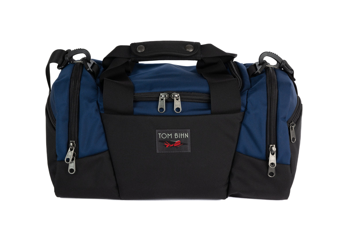 visible variant TB0904-DK4D TB0904-DKML TB0904-DKZD TB0904-DKPD^ TB0904-DKYD^^The Night Flight Travel Duffel in Deep Blue Ballistic