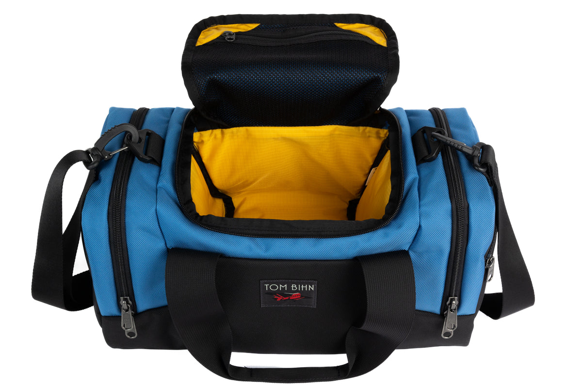visible variant TB0904-NKRL^^The Night Flight Travel Duffel in Constellation Ballistic with a Marigold 210 Cerylon interior.