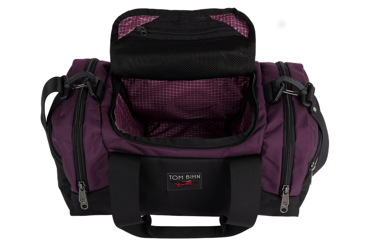 visible variant TB0904-UK5D^^The Night Flight Travel Duffel in Aubergine Ballistic with a Acai 200 Halcyon interior.