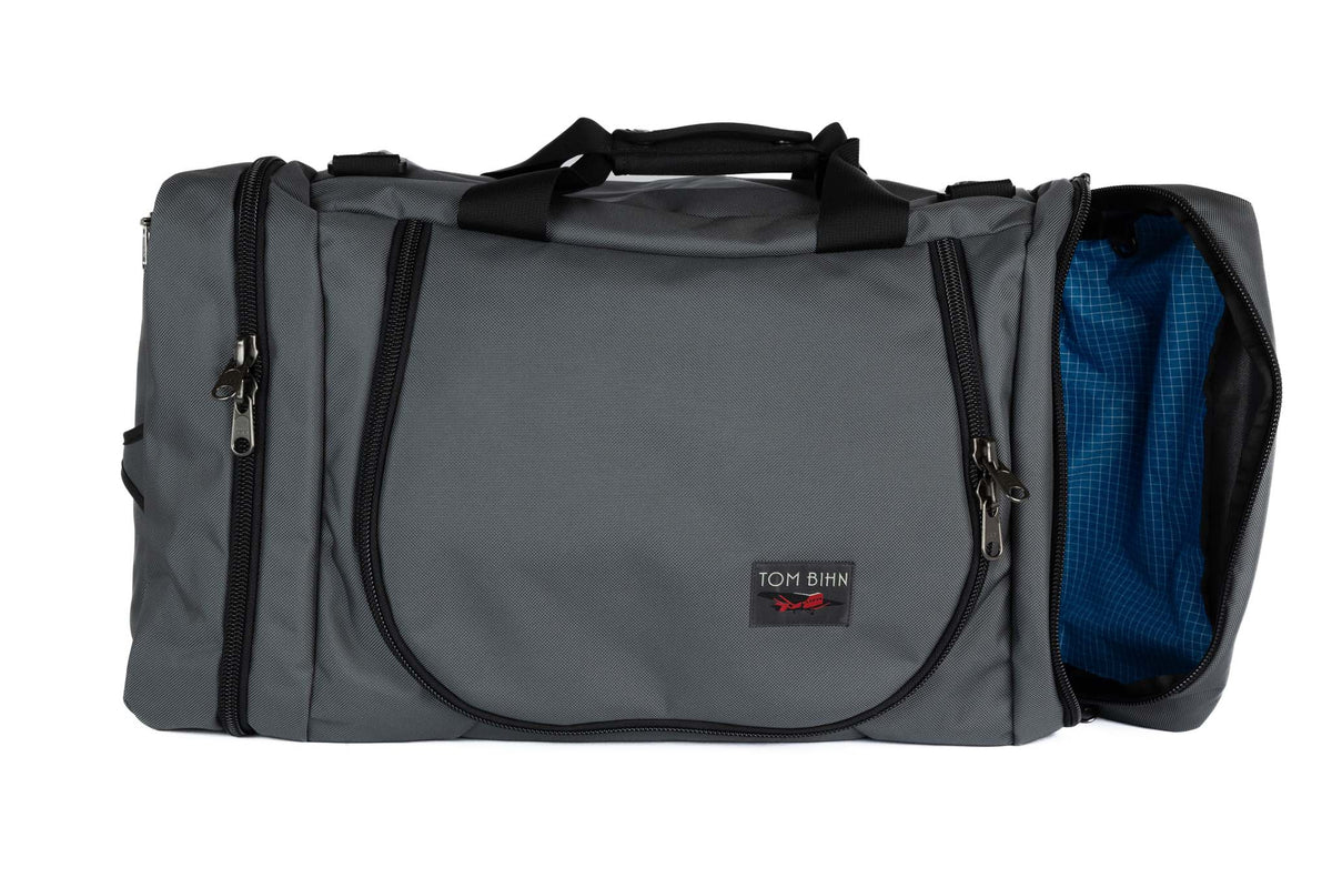 visible variant TB0906-GKLD^^A Nebulous Grey (medium grey) Ballistic Aeronaut 45 with the end pocket open showing the Island (blue) Halcyon.