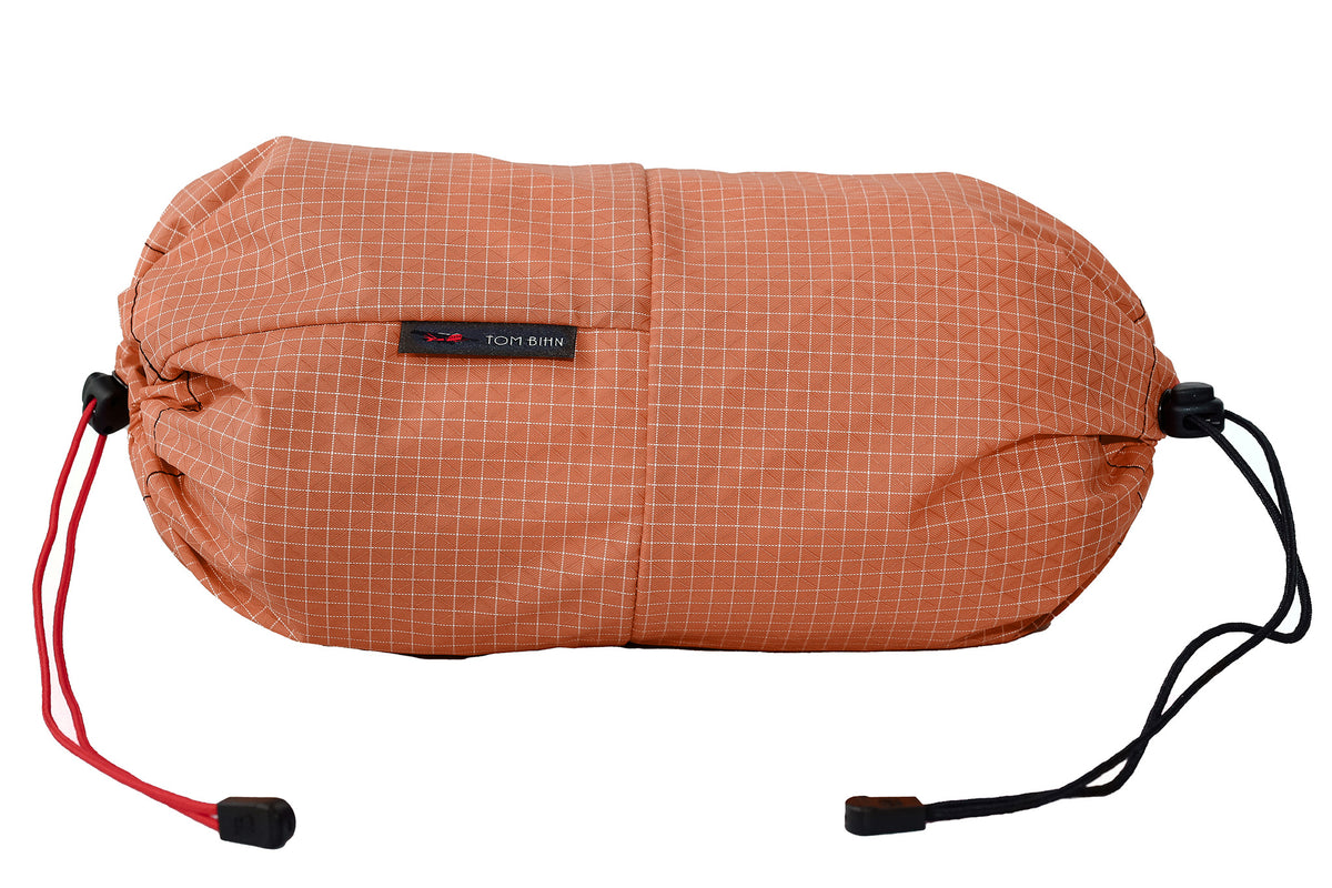 visible variant TB09376-3D^^An Aeronaut 45 Travel Laundry Stuff Sack in Cantaloupe (pale orange with white grid) 200 Halcyon.