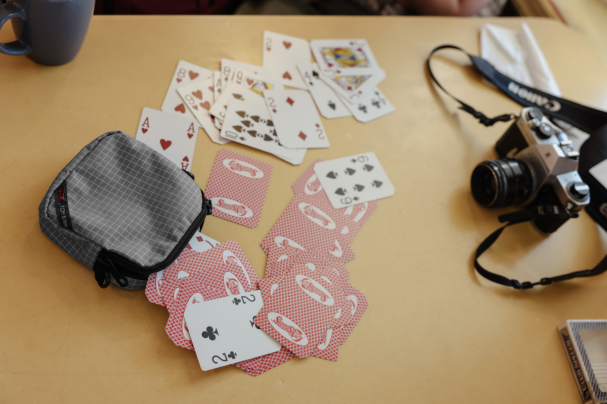 lifestyle visible^^Cubelet in Northwest Sky Halcyon with playing cards falling out.