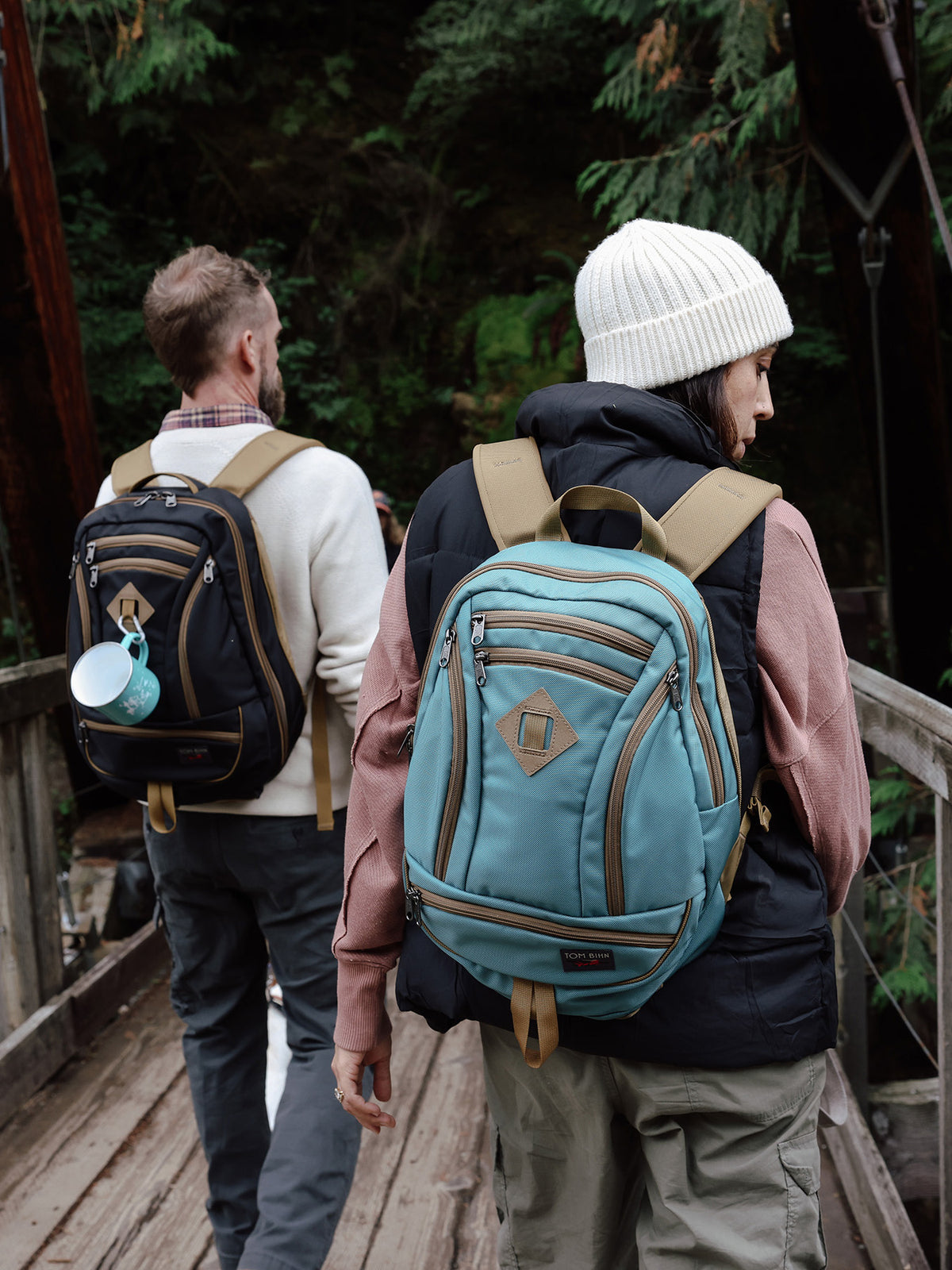 visible lifestyle^^A person carrying a GE Synapse 19 on a bridge