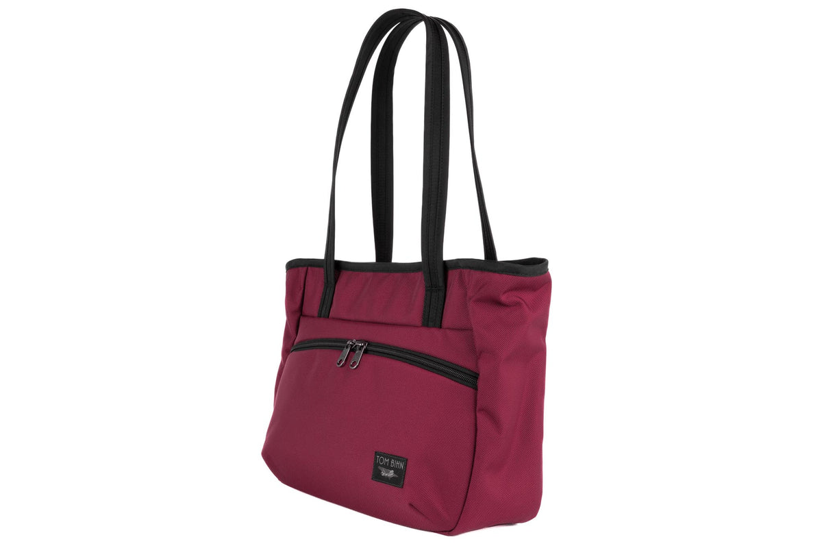 visible variant TB0715-PKML^^Photo of the Nomad Tote in Raspberry (reddish-purple) Ballistic