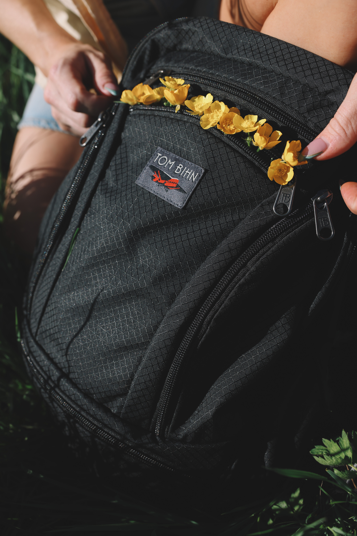 visible lifestyle^^front pocket of Synapse 19 filled with flowers.