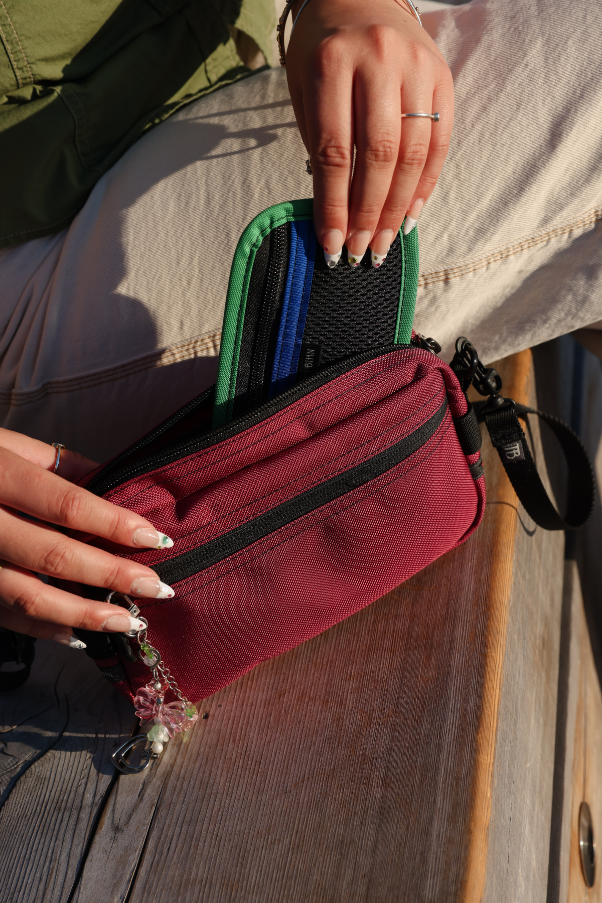 lifestyle visible^^ Person pulling a Mystery Organizer Pouch out of Side Effect