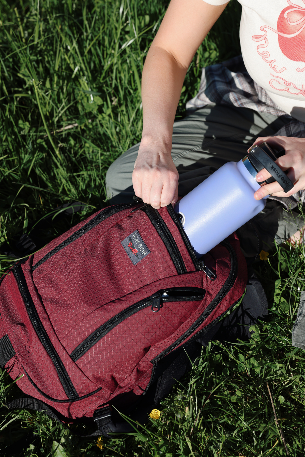 visible lifestyle^^A person pulling a hydroflask from Synapse 19.