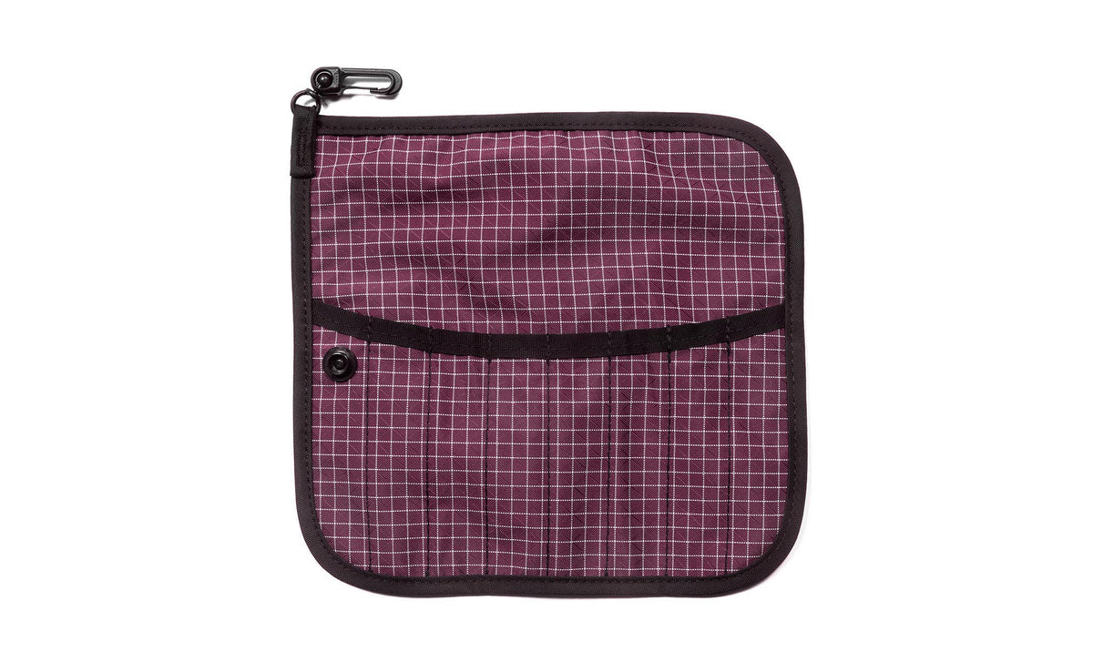 visible variant TB1235-5D^^The front of a Tool Pen Wrap in Acai (dark purple with white grid) 200 Halcyon.