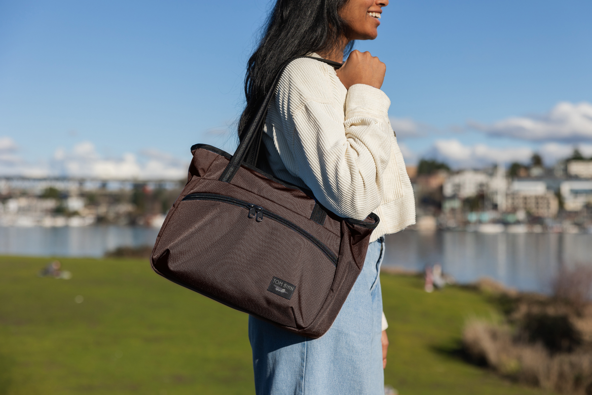 visible lifestyle^^A person carrying a Nomad Tote on their shoulder.