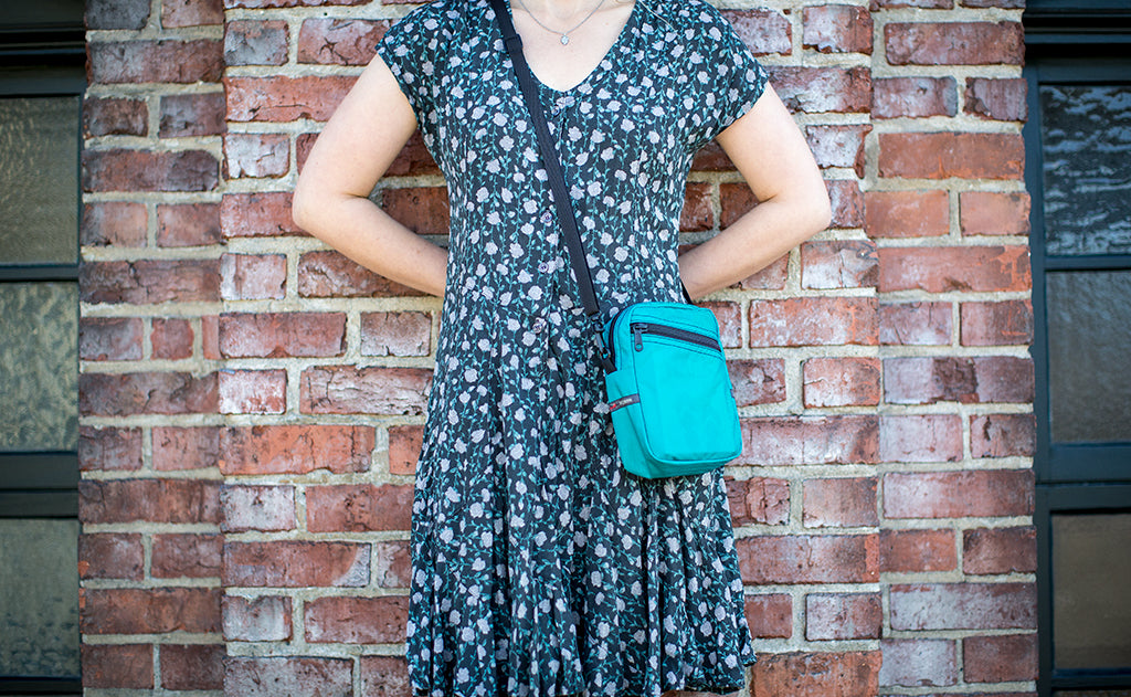 ^^Person wearing the Everyday Cubelet across body.
