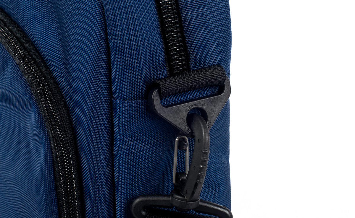Shoulder strap attachment point at the base of the main compartment zipper.