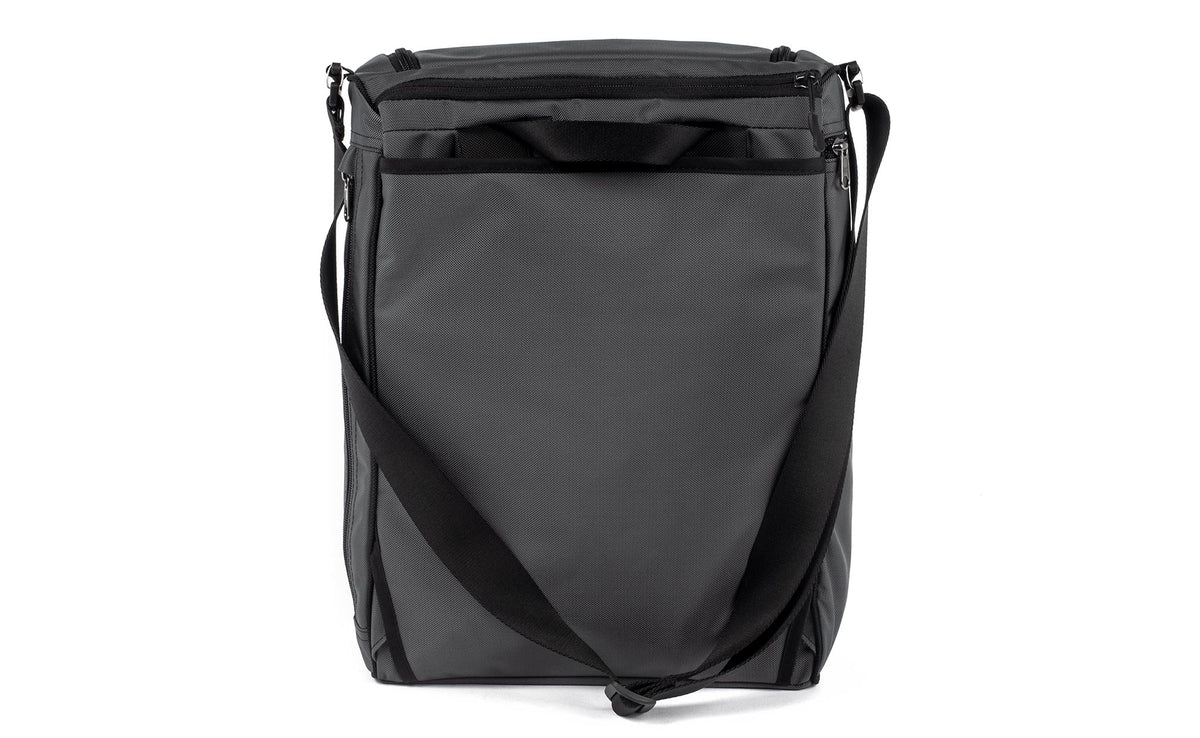 detail visible^^Back of Cambiata with backpack straps tucked away and shoulder strap attached.