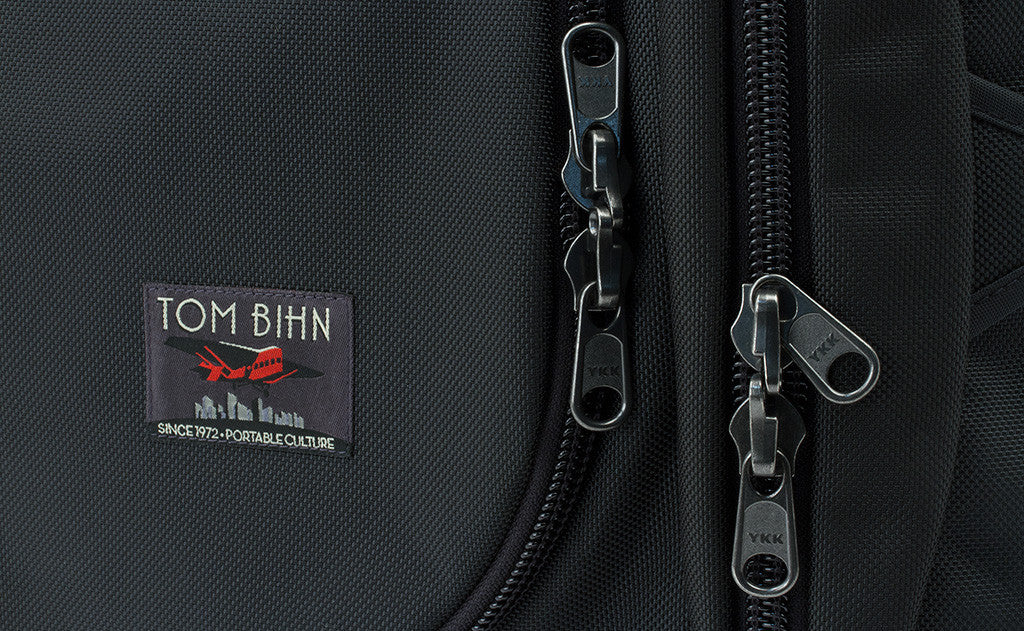 The main compartment and side pockets have locking zippers.