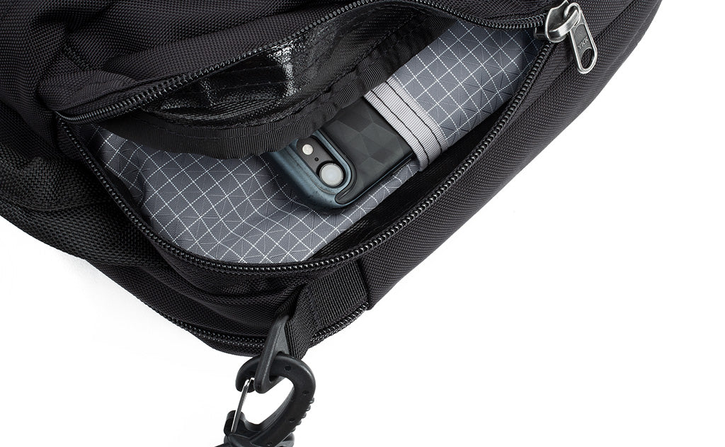 Close-up of a phone in one of the front organizer pockets of the Co-Pilot.