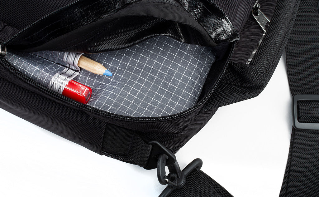 Close-up of a pen and pencil in the organizer pockets of the Co-Pilot.